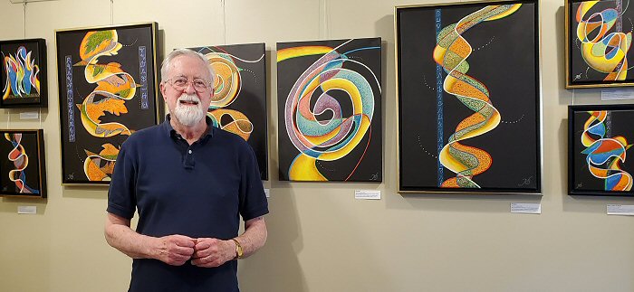 the artist with an
                                            exhibition of his work